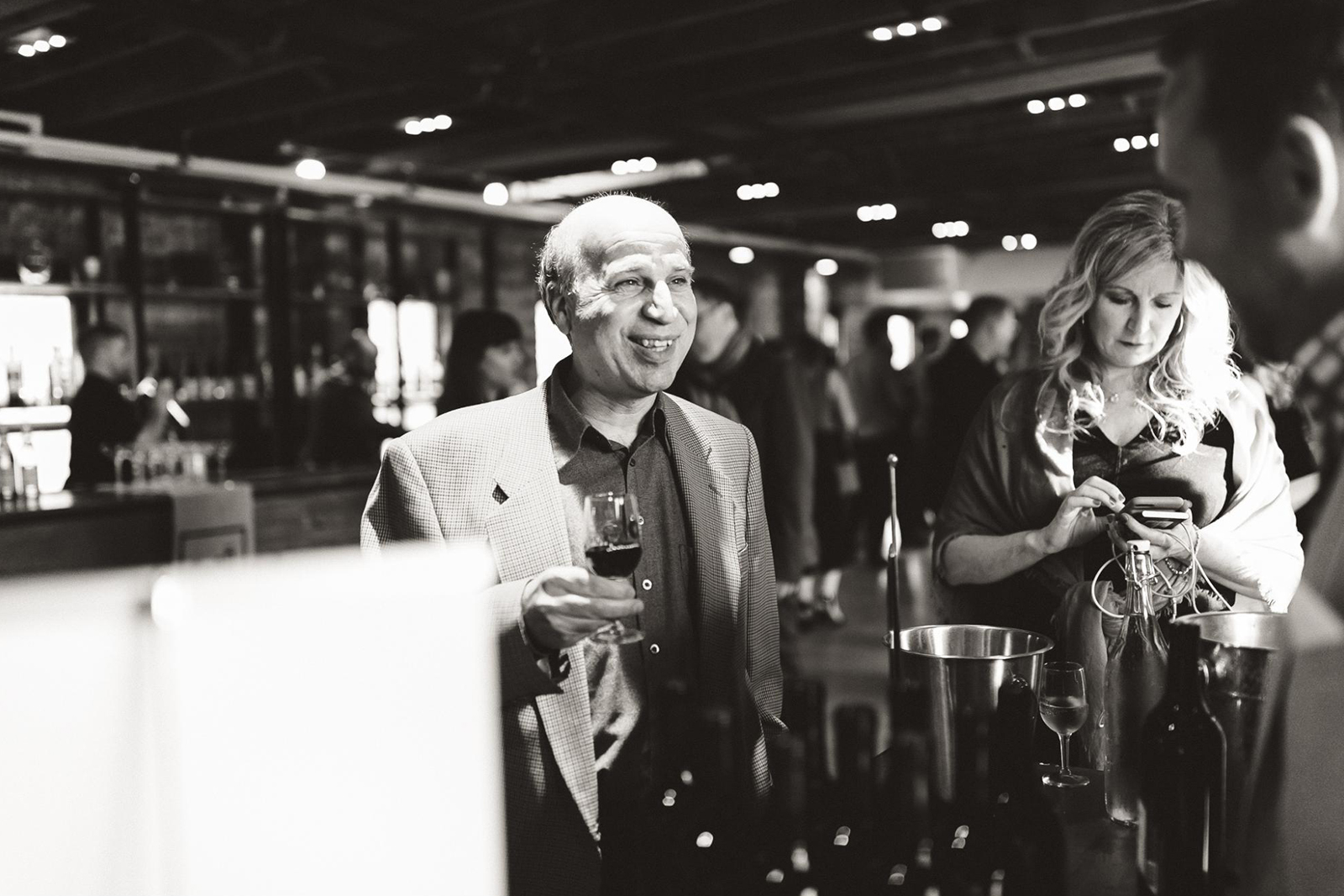 A businessman building connections during a networking event held at The Loft on King