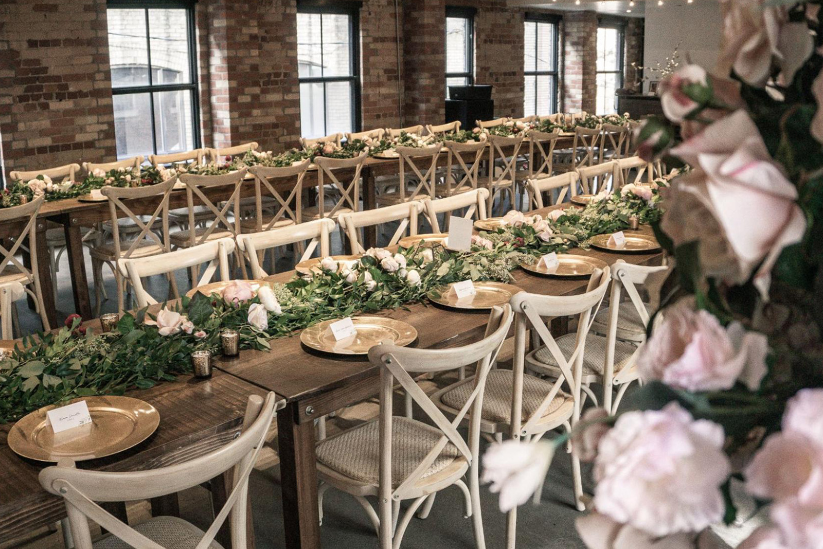  Dinner tables beautifully arranged and decorated for a wedding event at The Loft on King
