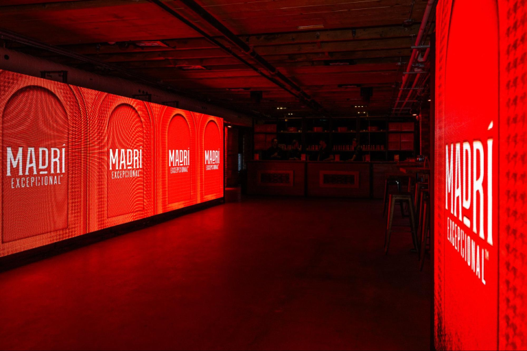 The Loft on King decorated with two LED walls showing the logo of the brand Madri 
