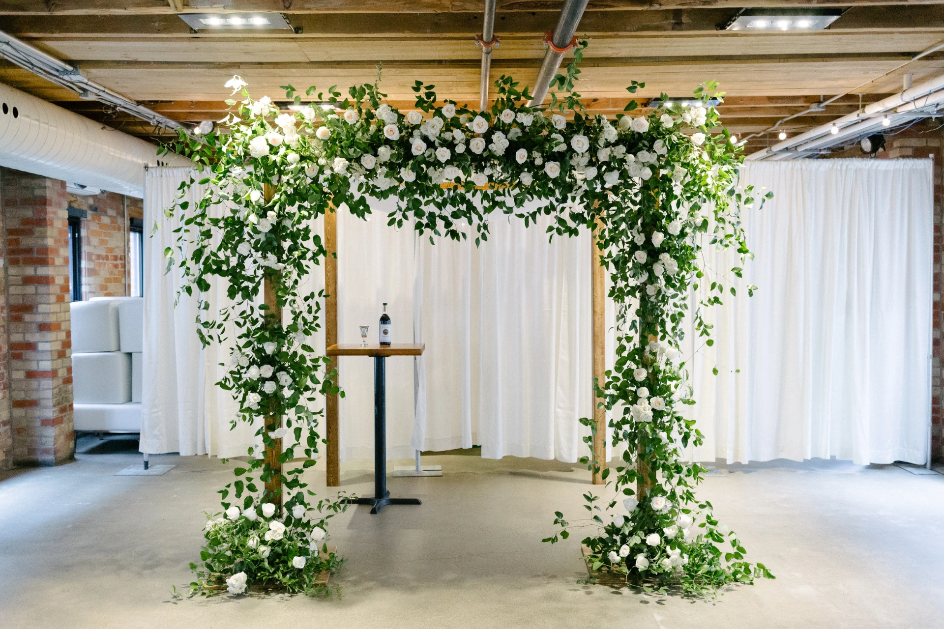 Square floral wedding arch in The Loft on King Street West