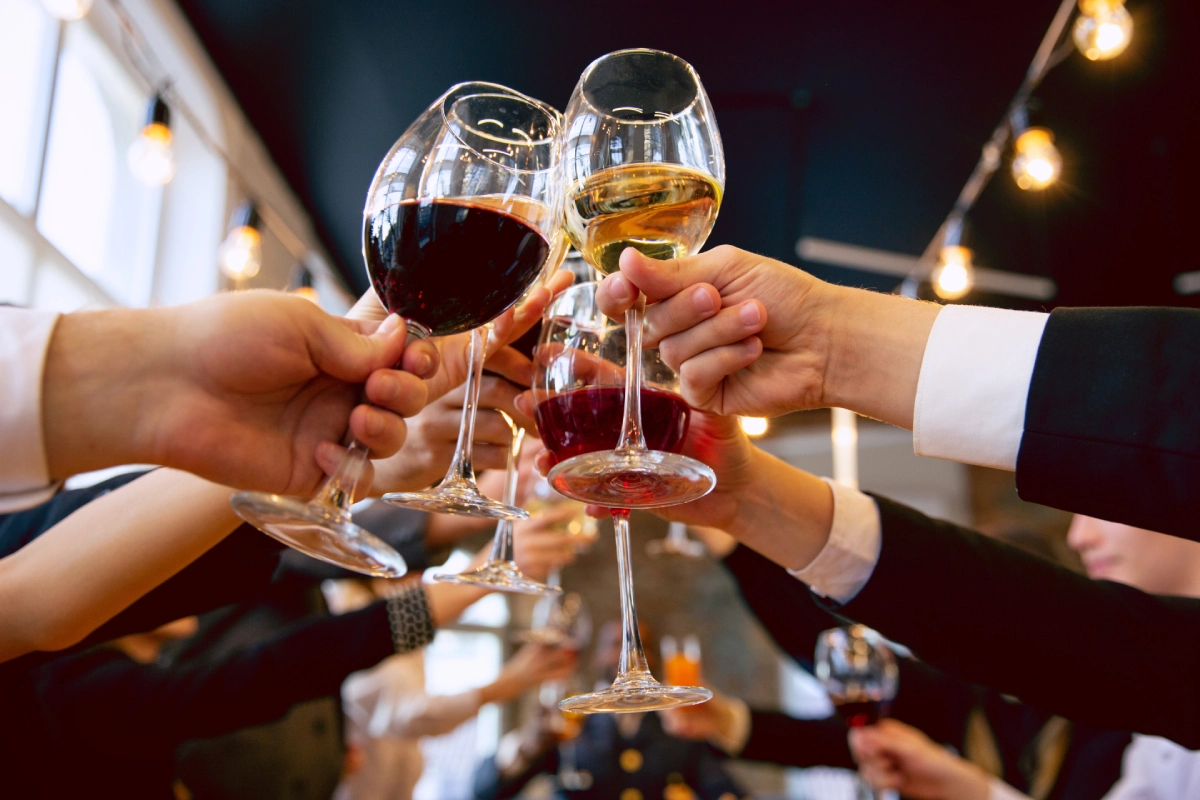 Happy co-workers celebrating at a company party and corporate event