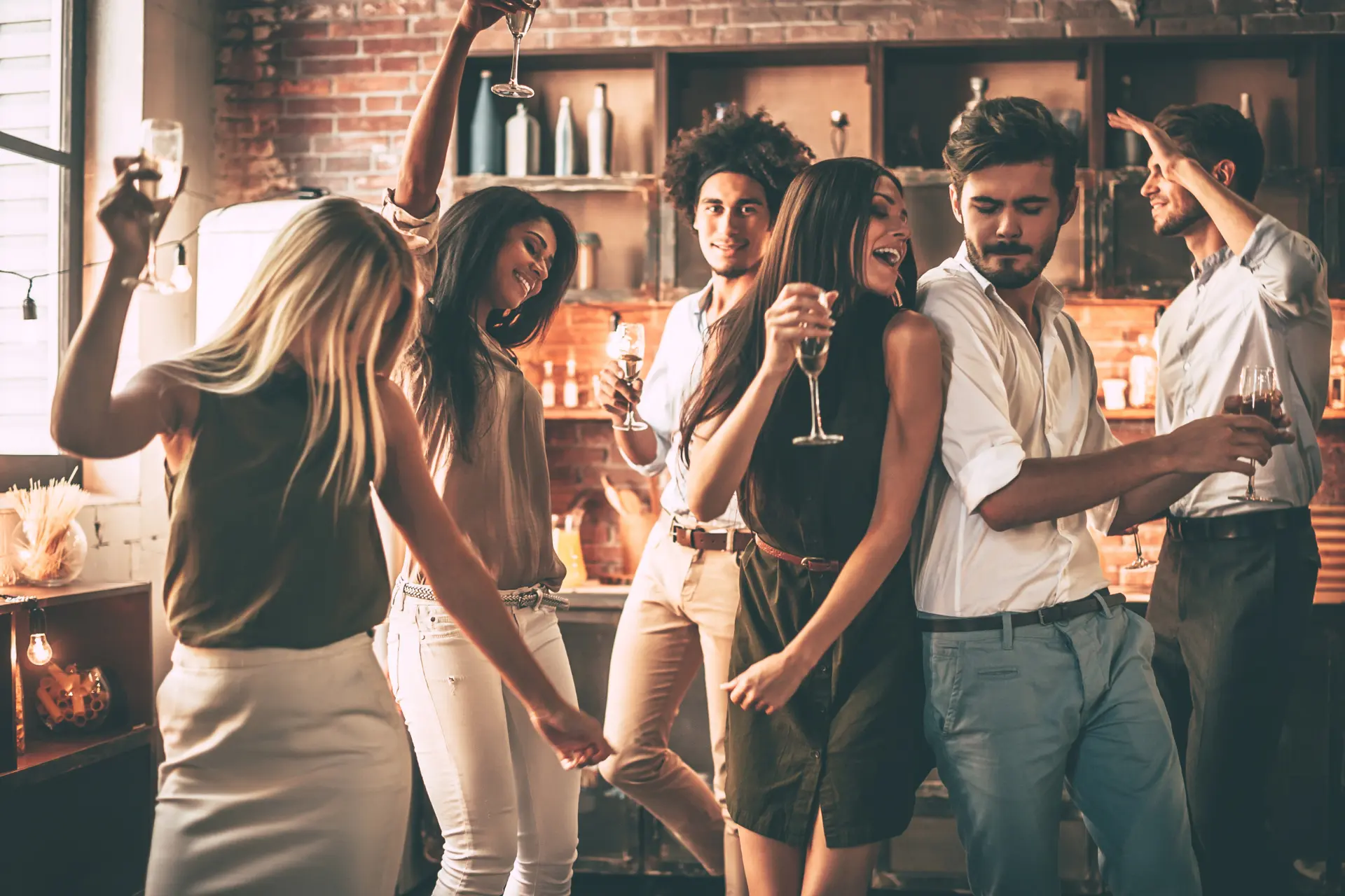 Young professionals having a dance party at a loft 
