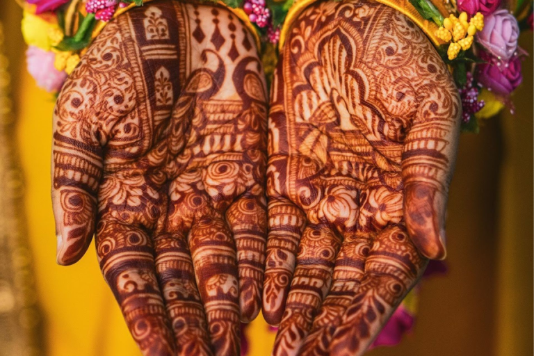 Warding off pesky evil spirits at the wedding site with henna